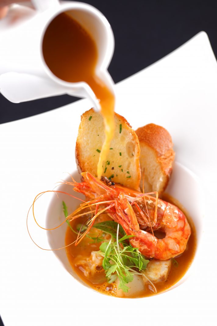 Seafood soup with garlic bruschetta