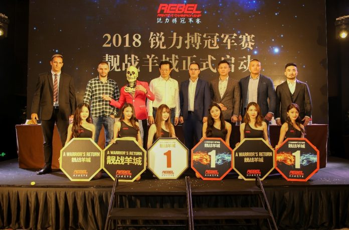 Zhou Chun, director of Guangdong Sports Channel (fourth from left) and REBEL FC CEO Justin Leong (fifth from left) together with the main MMA stars and ring girls of REBEL FC 8 – A Warrior’s Return.